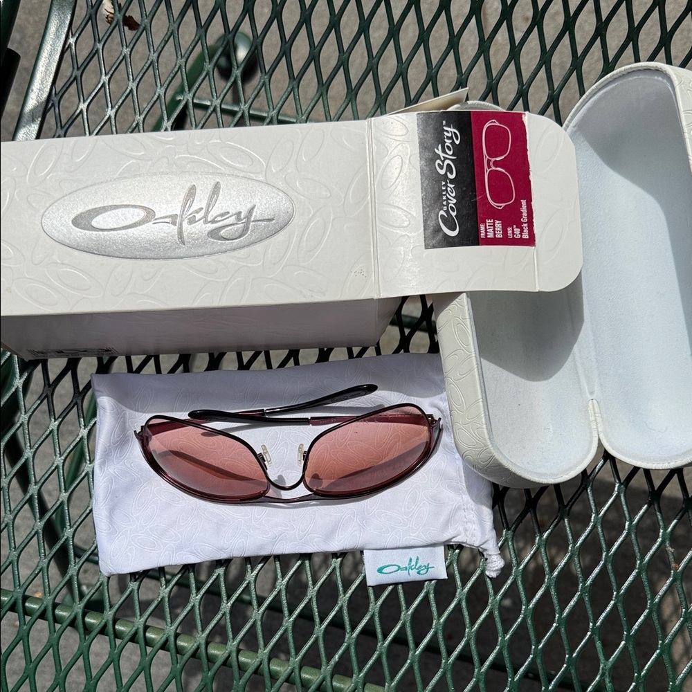 Oakley Sunglasses with Rose-Pink Lenses and Dark Frame